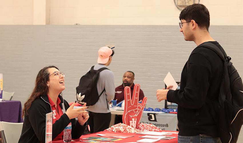 Student getting information at one of the Universities' booths.